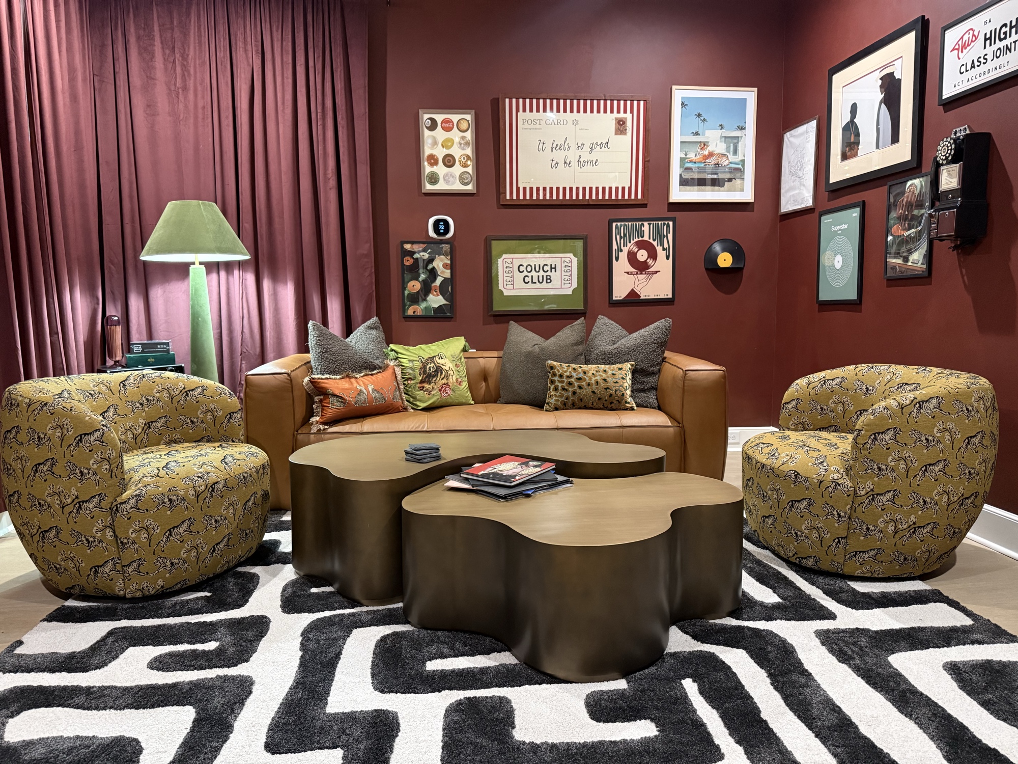 Eclectic vintage living room with burgundy walls and gallery wall