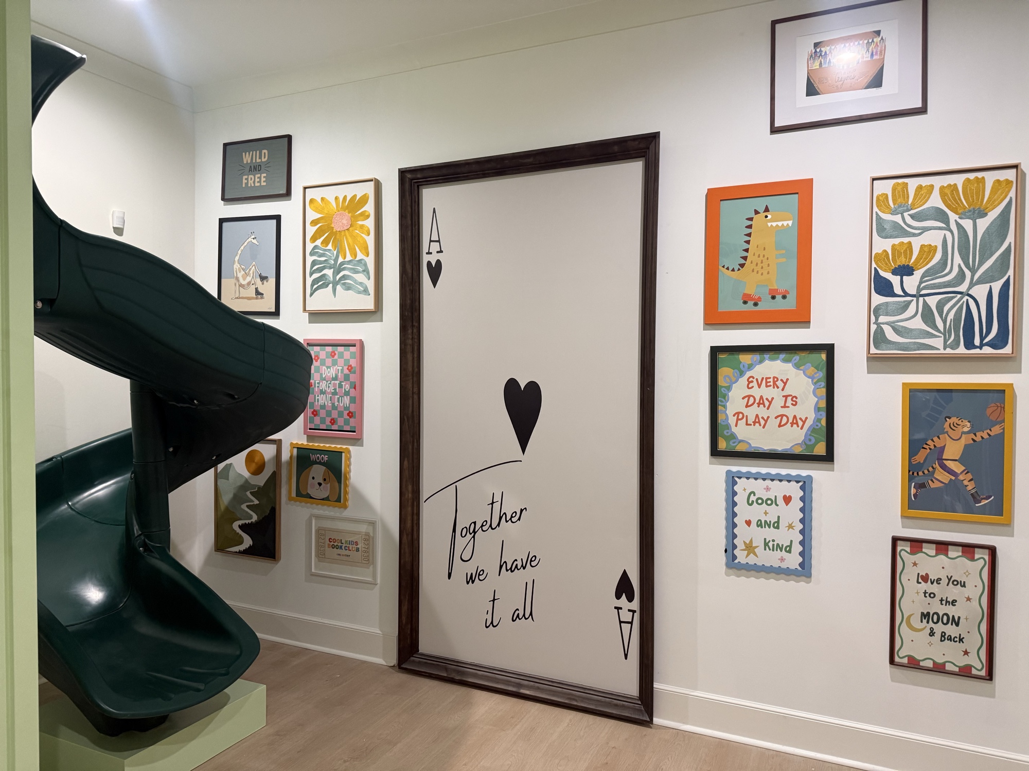 Playroom gallery wall with ace card door art installation